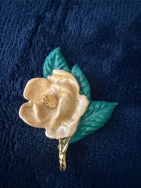 Gold Flower Brooch with Green Leaves